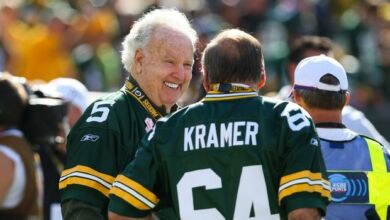 Oct 2, 2011; Green Bay, WI, USA; Former Green Bay Packers Paul Hornung (5) and Jerry Kramer (64) talk prior to the game against the Denver Broncos at Lambeau Field. The Packers defeated the Broncos 49-23. Mandatory Credit: Brace Hemmelgarn-USA TODAY Sports