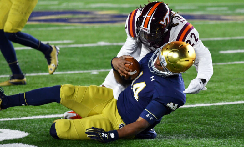 Notre Dame QB Deshone Kizer taking one of two uncalled helmet to helmet hits in 2016 contest with Virginia Tech