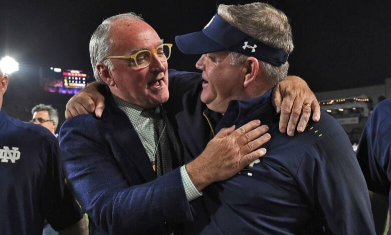 Notre Dame HC Brian Kelly and AD Jack Swarbrick celebrate their 2nd perfect regular season at Notre Dame