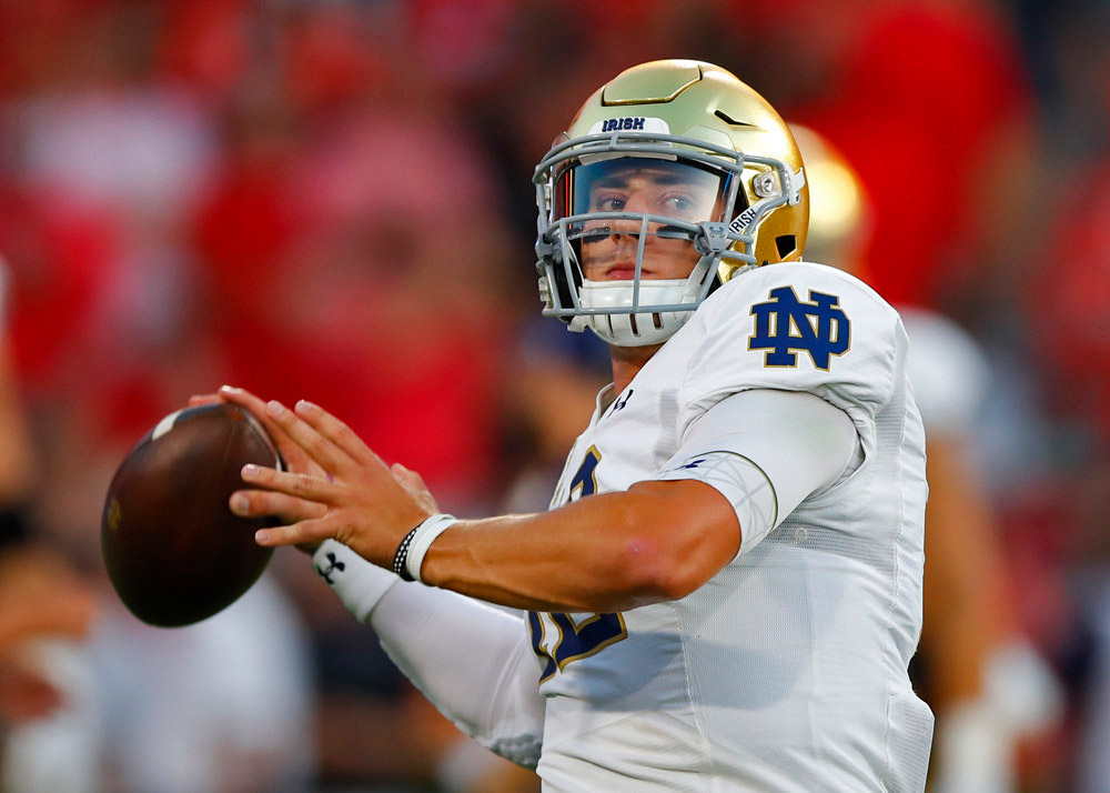 Ian Book of the Notre Dame Fighting Irish passes during their game