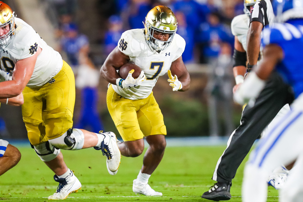 SOUTH BEND, IN - SEPTEMBER 02: Notre Dame Fighting Irish running back Audric  Estime (7) runs with the football in action during a game between the Notre  Dame Fighting Irish and the